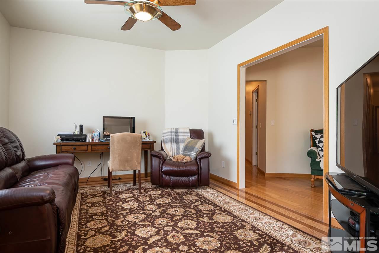 796 Foothill Road Gardnerville, NV 89460 - Photo 35 of 38 a living room with furniture and a flat screen tv