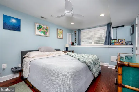a spacious bathroom with a double vanity sink toilet and shower