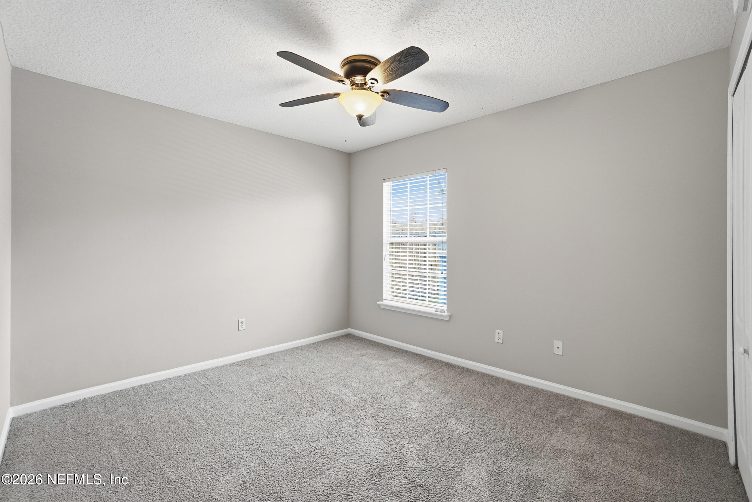 1194 Ardmore Street St. Augustine, FL 32092 - Photo 11 of 48 an empty room with ceiling fan and window