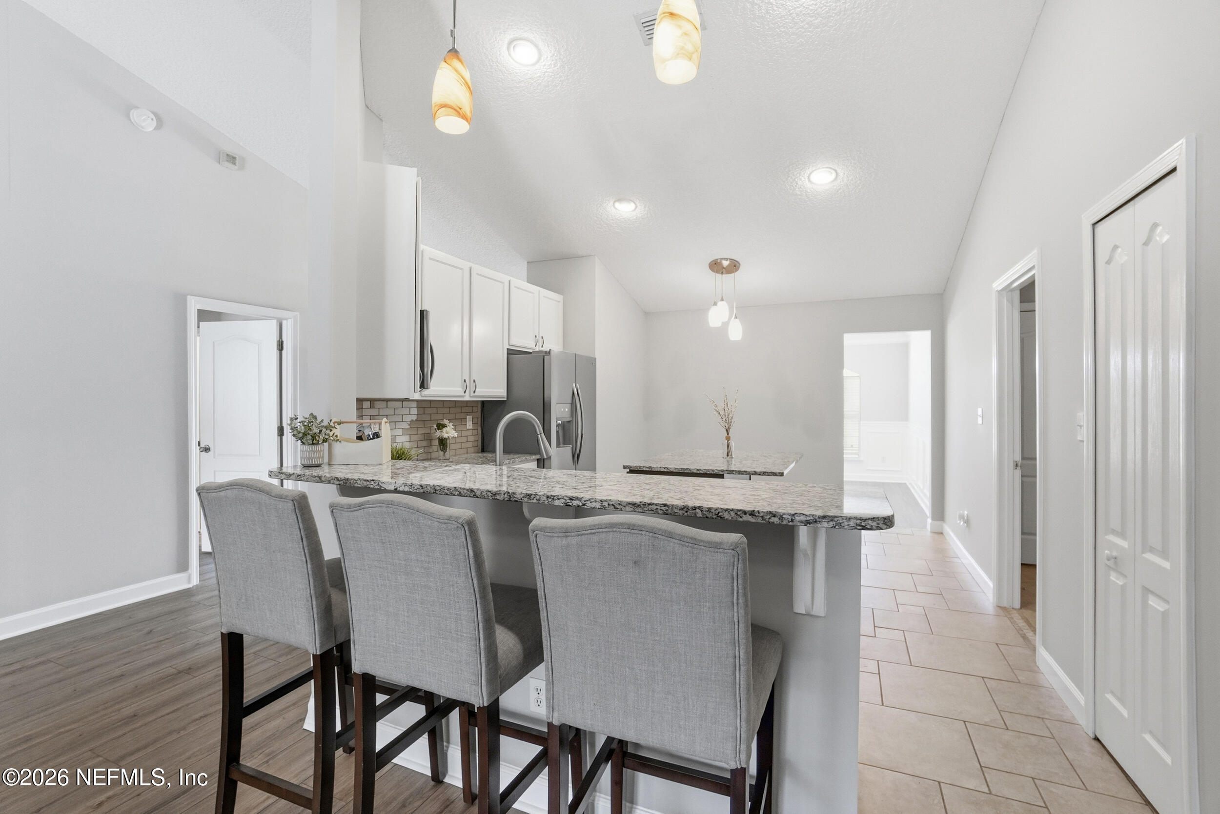 1194 Ardmore Street St. Augustine, FL 32092 - Photo 12 of 48 a kitchen with stainless steel appliances kitchen island granite countertop a sink and cabinets