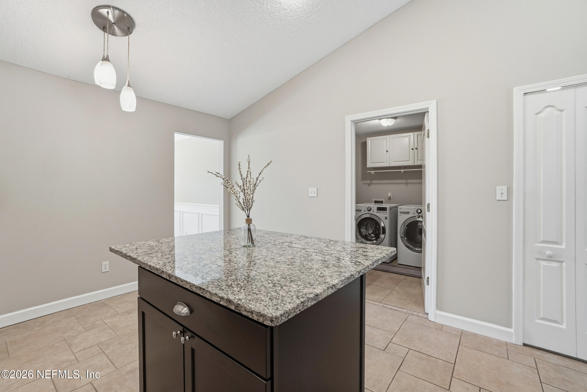 1194 Ardmore Street St. Augustine, FL 32092 - Photo 16 of 48 a kitchen with granite countertop a sink a stove and cabinets