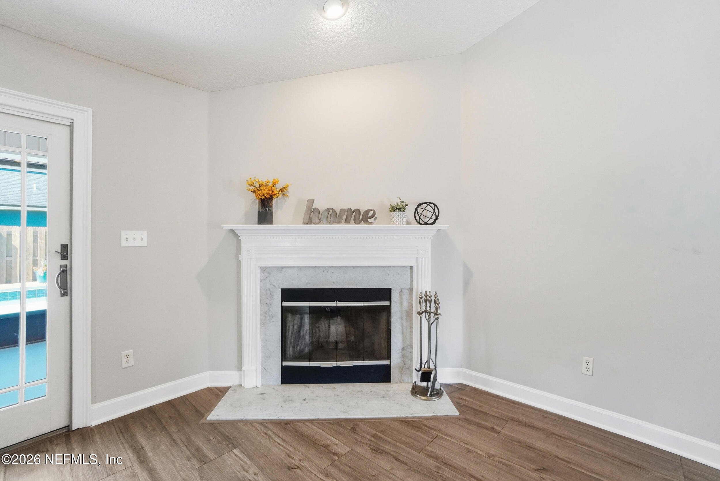 1194 Ardmore Street St. Augustine, FL 32092 - Photo 22 of 48 a living room with a fireplace