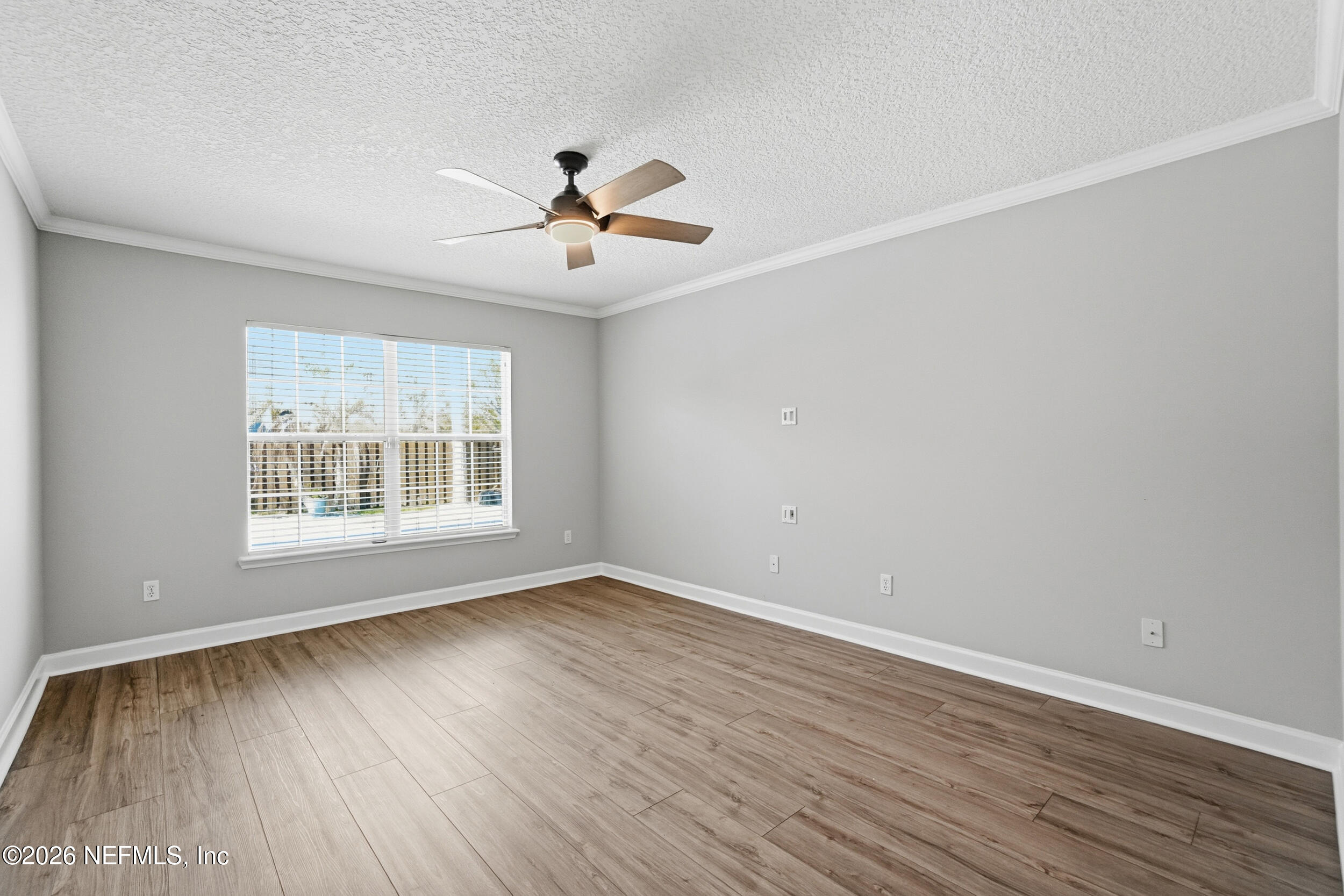 1194 Ardmore Street St. Augustine, FL 32092 - Photo 26 of 48 a view of an empty room with wooden floor and a window