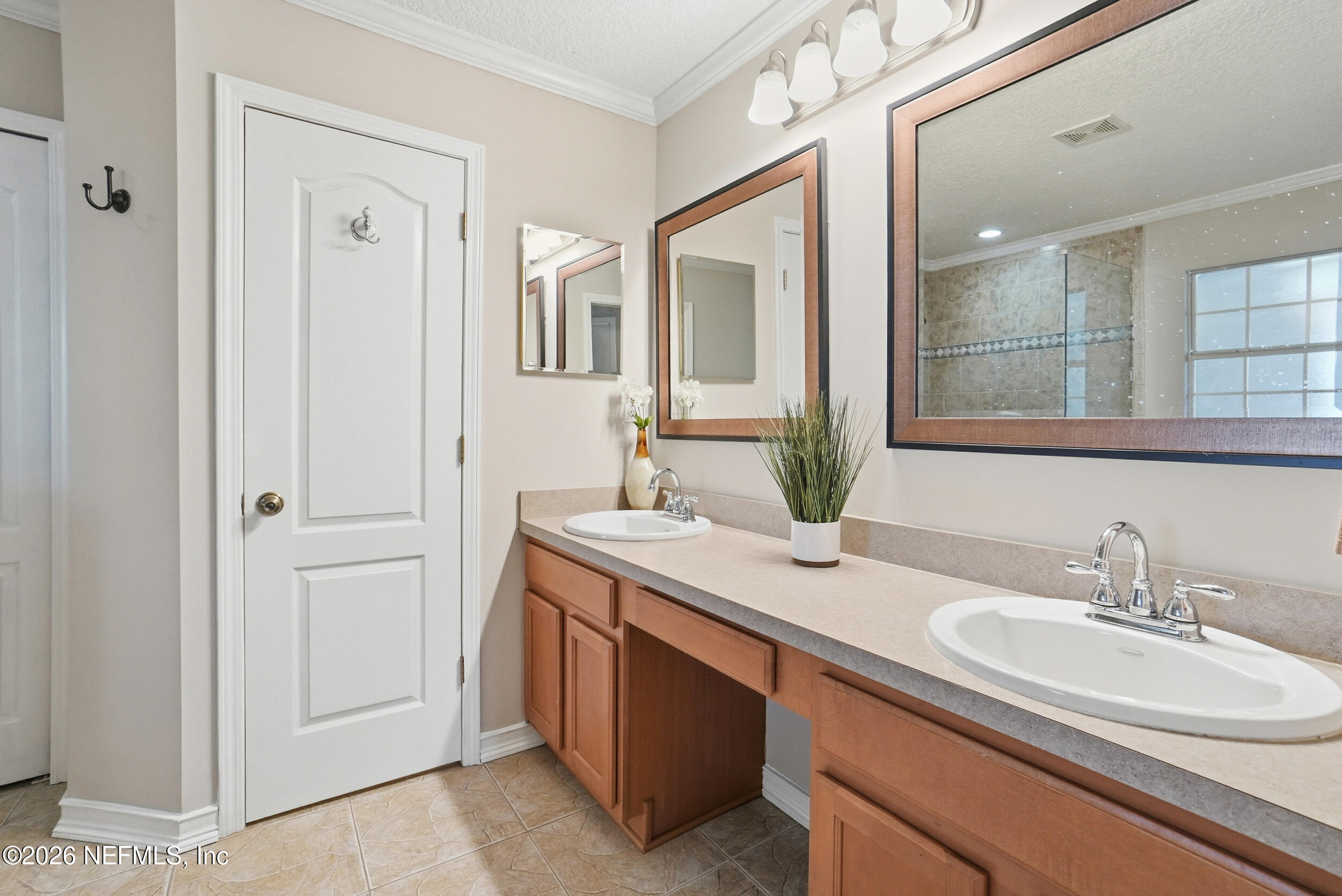 1194 Ardmore Street St. Augustine, FL 32092 - Photo 27 of 48 a bathroom with 2 sink and a mirror