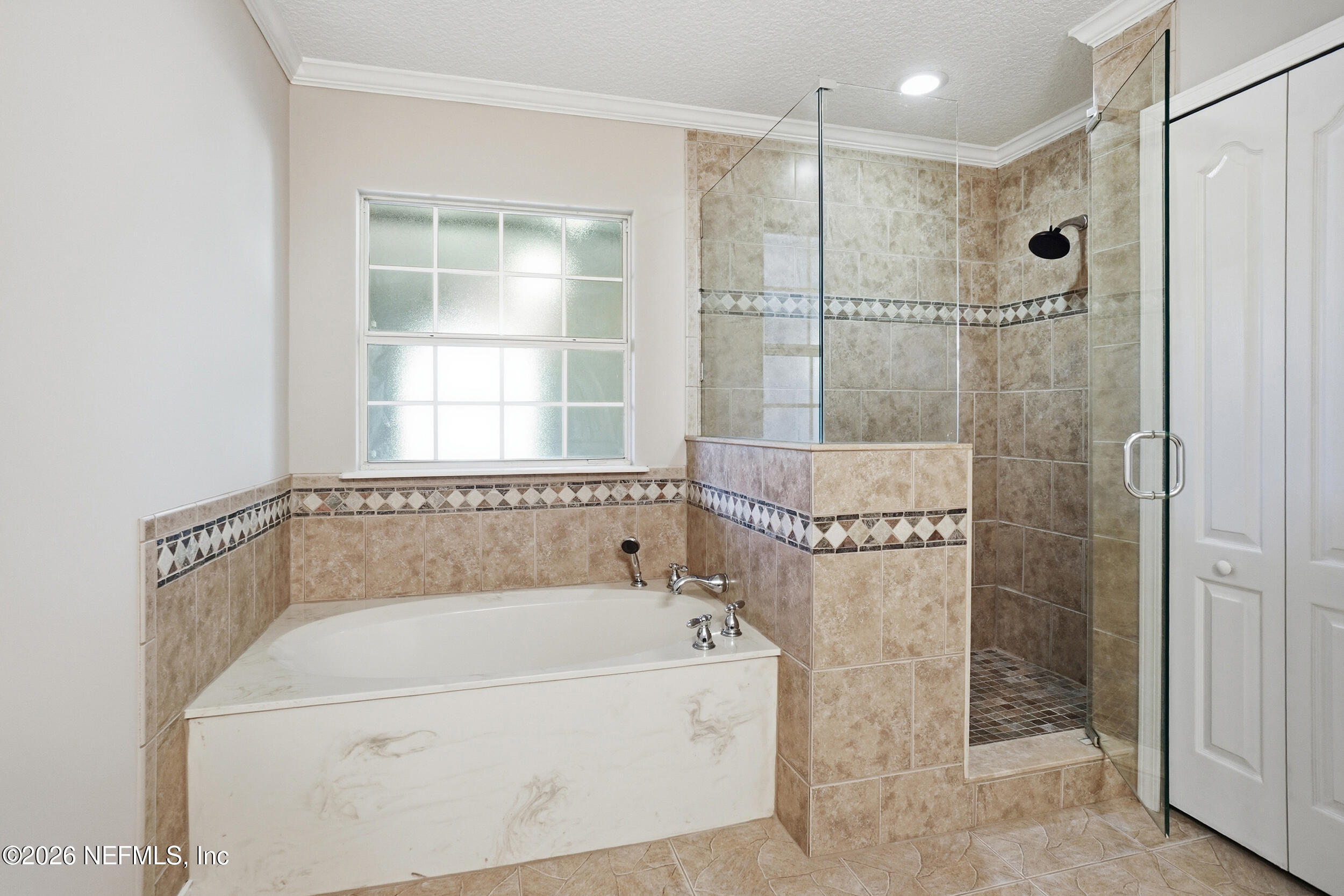 1194 Ardmore Street St. Augustine, FL 32092 - Photo 28 of 48 a white bath tub sitting next to a shower