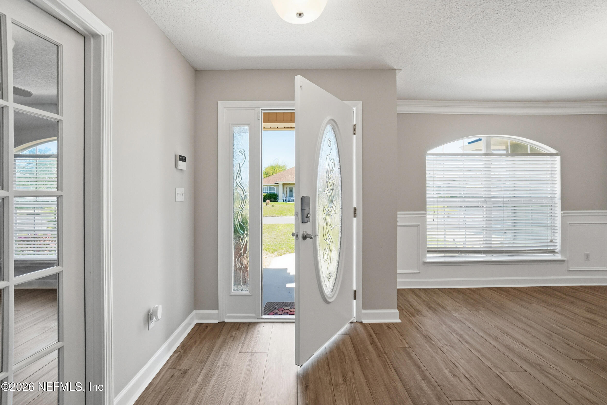 1194 Ardmore Street St. Augustine, FL 32092 - Photo 5 of 48 an empty room with wooden floor and windows