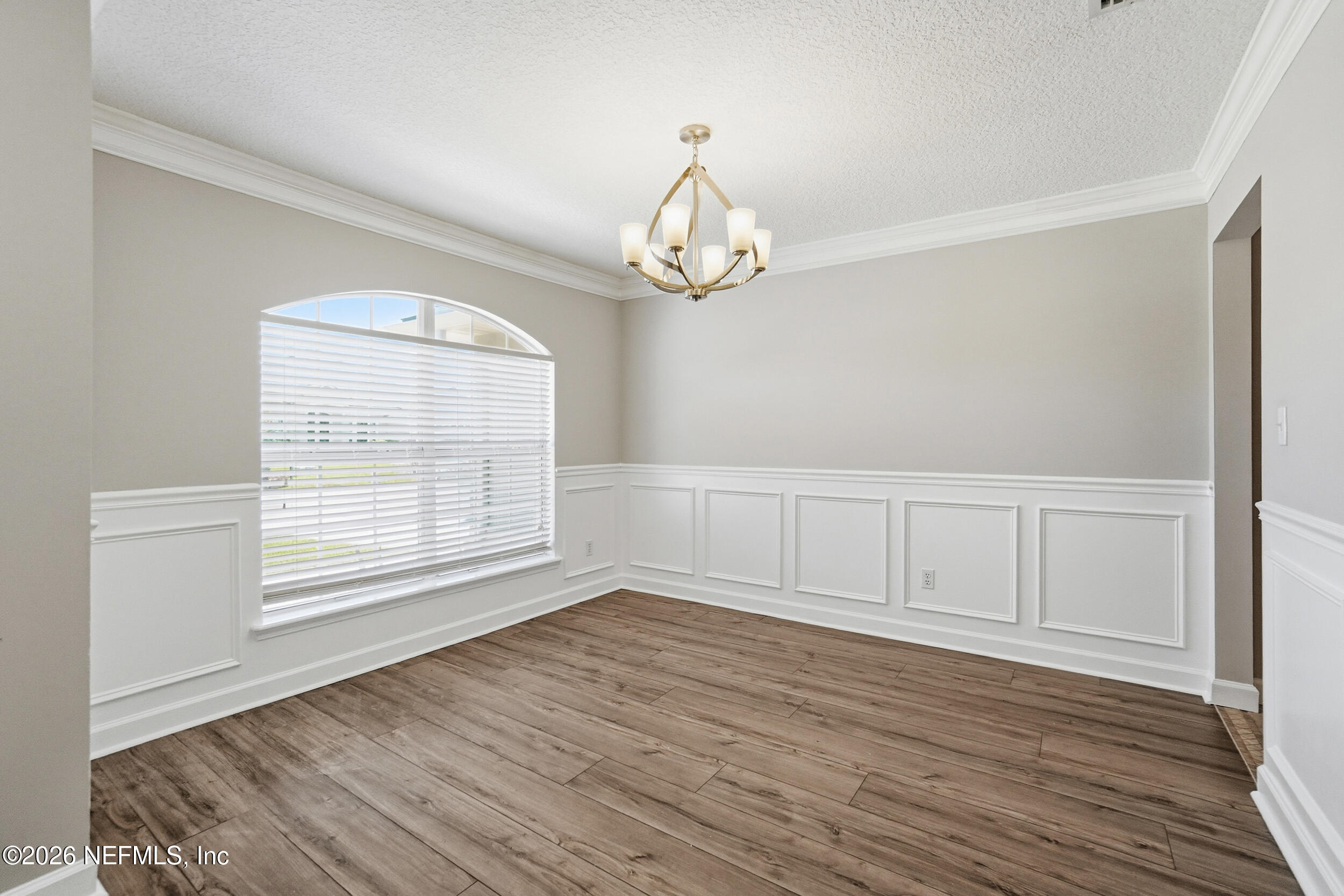1194 Ardmore Street St. Augustine, FL 32092 - Photo 7 of 48 wooden floor in an empty room with a window