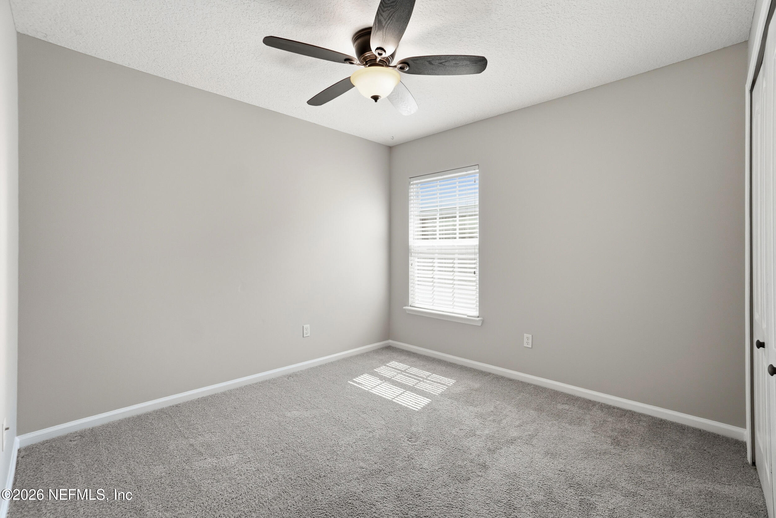 1194 Ardmore Street St. Augustine, FL 32092 - Photo 10 of 48 an empty room with a window and a fan