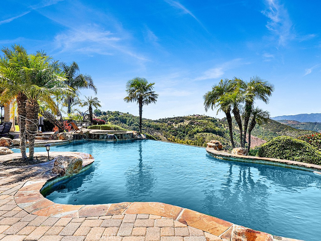 25900 Carancho Road Temecula, CA 92590 - Photo 14 of 58 a view of a swimming pool with a lake view