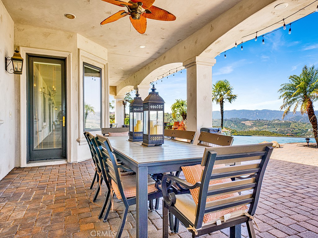 25900 Carancho Road Temecula, CA 92590 - Photo 16 of 58 a view of a dining room with furniture window and wooden floor