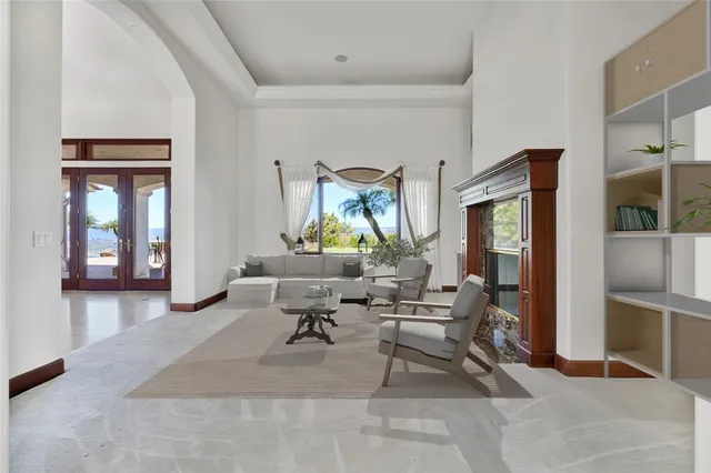 a spacious bathroom with a granite countertop sink a mirror and a shower