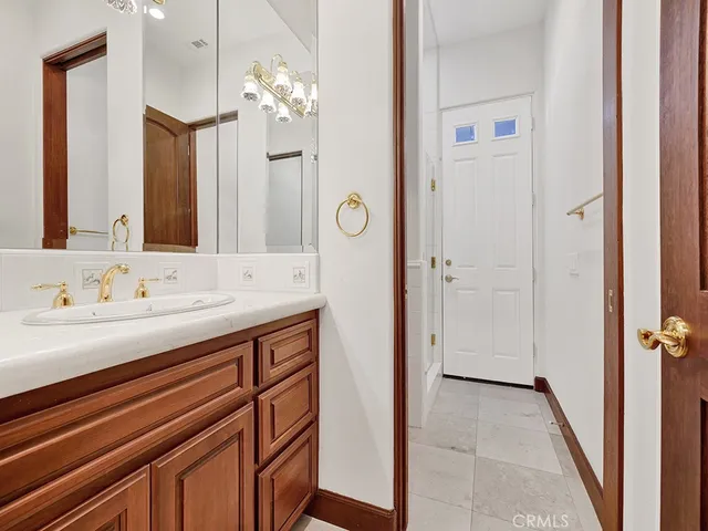 a view of a kitchen with a sink and cabinets