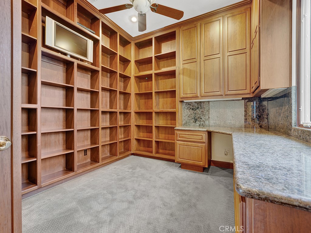 25900 Carancho Road Temecula, CA 92590 - Photo 30 of 58 a view of an empty room with cabinet and a window