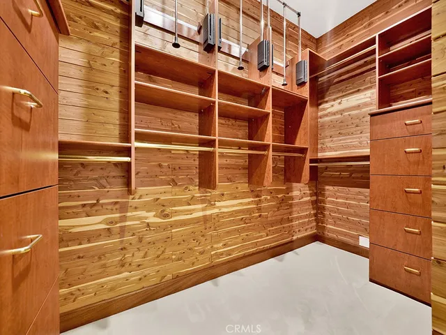 a kitchen with kitchen island granite countertop a sink a stove and a refrigerator