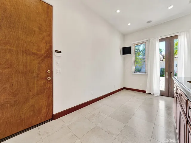 a kitchen with a stove window and cabinets