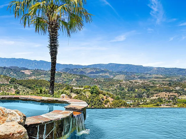 a view of swimming pool with lake view and mountain view