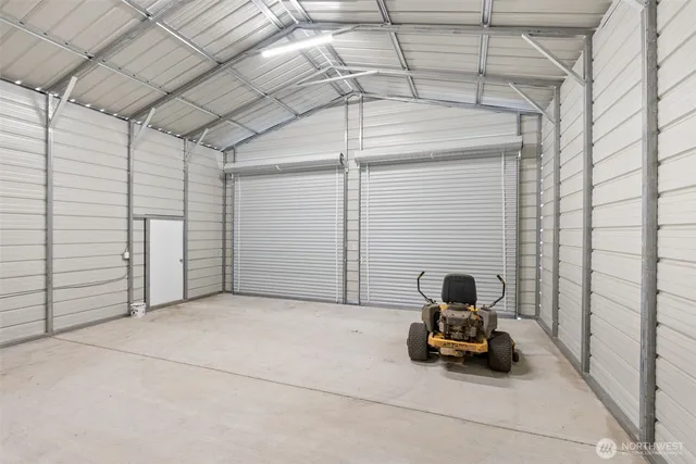 a view of a garage with parked cars