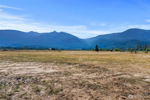 a view of an ocean and a mountain
