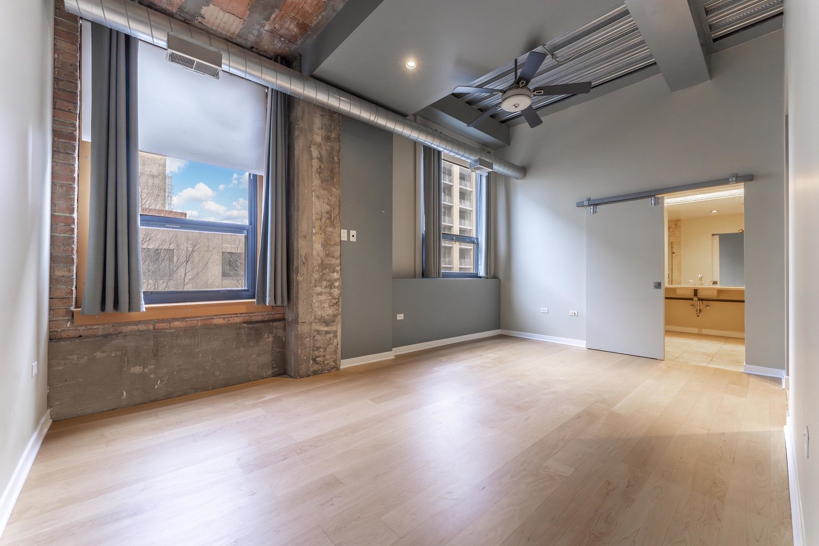 1910 South Indiana Avenue, Unit 421 Chicago, IL 60616 - Photo 11 of 28 a view of empty room with wooden floor and fan