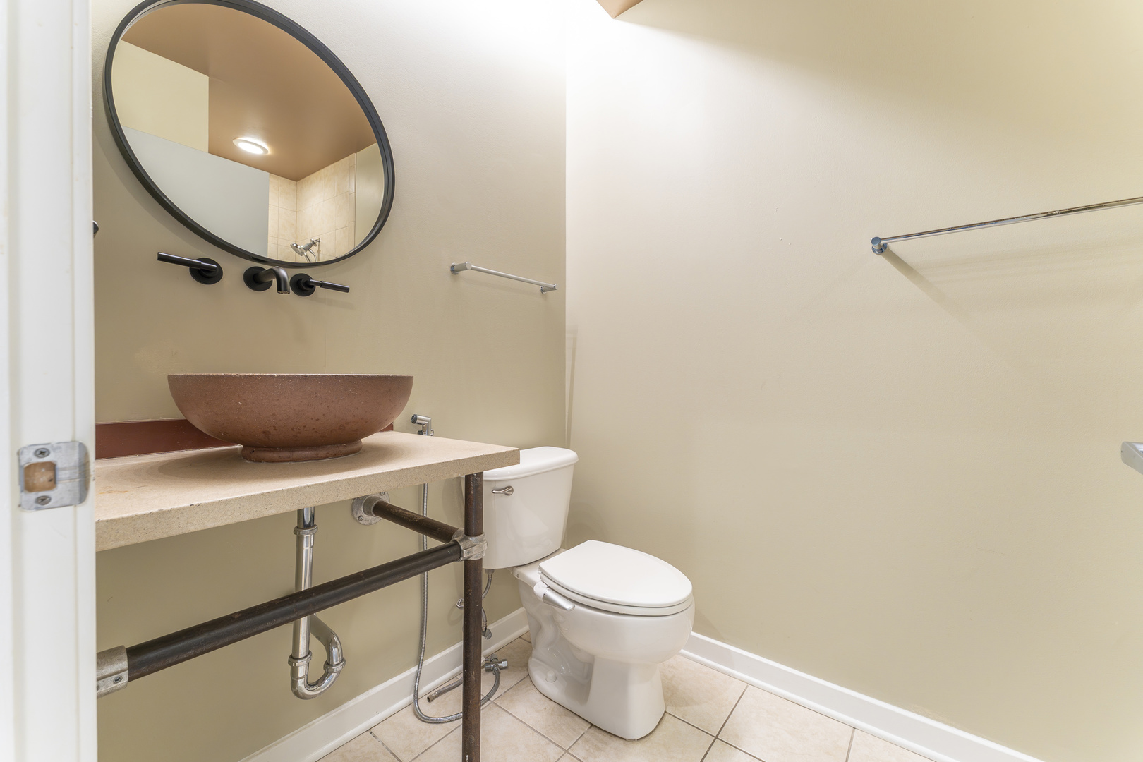1910 South Indiana Avenue, Unit 421 Chicago, IL 60616 - Photo 19 of 28 a bathroom with a toilet and a mirror