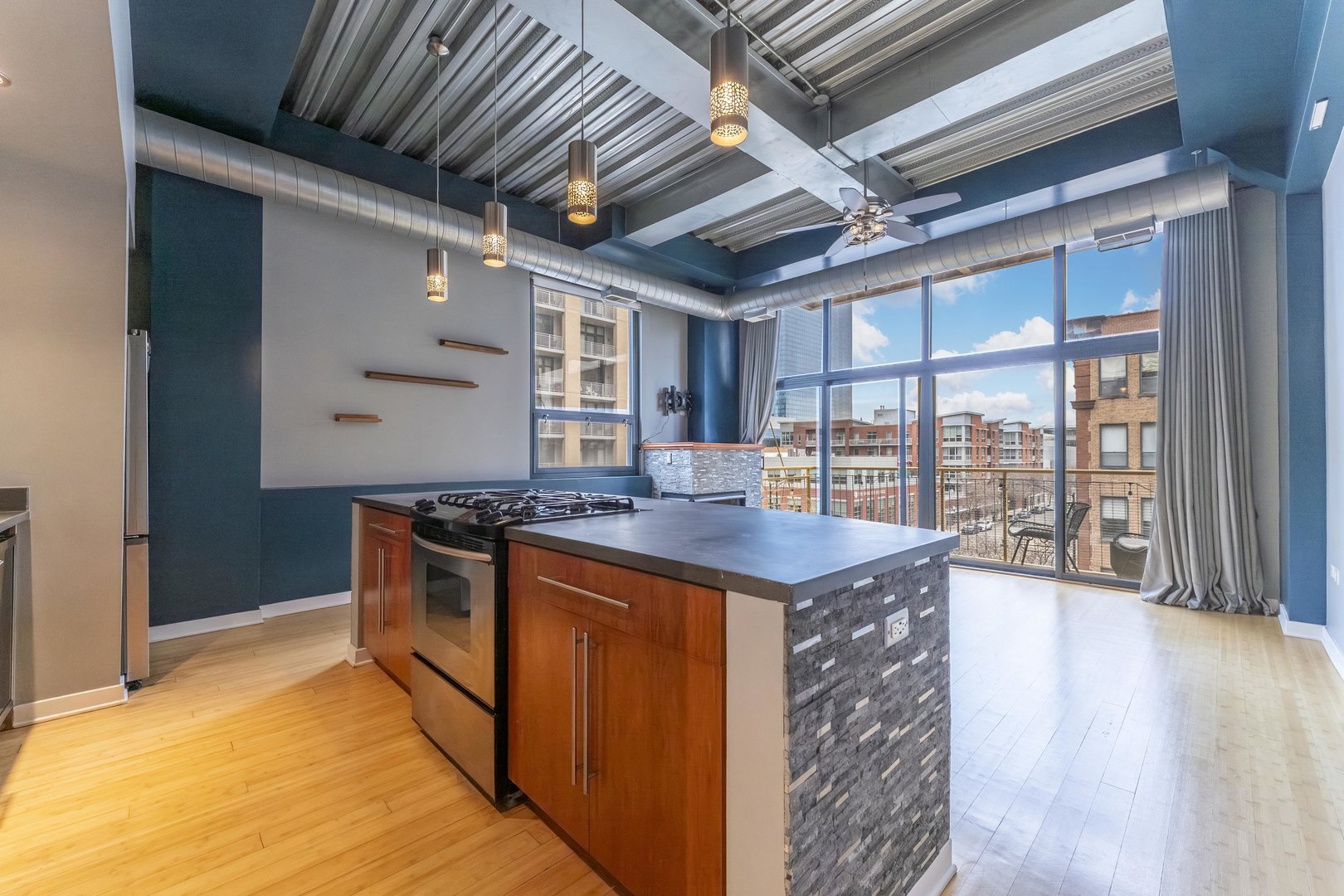 1910 South Indiana Avenue, Unit 421 Chicago, IL 60616 - Photo 2 of 28 a kitchen with stainless steel appliances granite countertop a stove a sink and a refrigerator