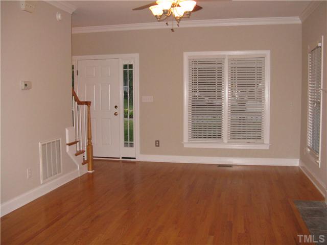 Alternate view of the family room. Solid wood front door with beautiful side lights.