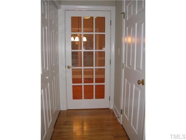 Hallway from kitchen to laundry room, powder room and dining room.  The interior of the home has been freshly painted