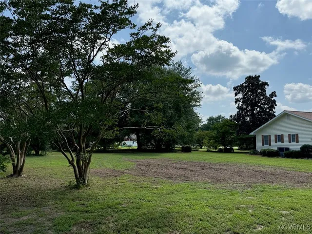 a view of house with yard