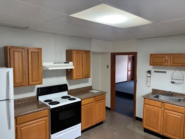 a kitchen with a stove and a refrigerator