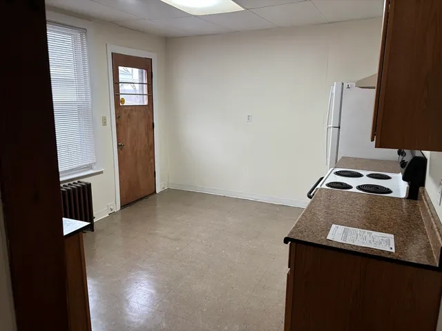 a room with a desk and a window