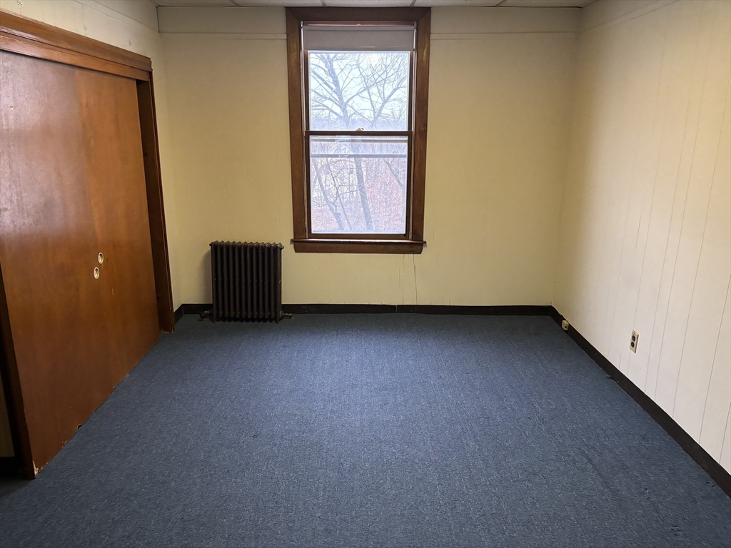 324 Boston Avenue, Unit 2L Medford, MA 02155 - Photo 4 of 4 an empty room with windows