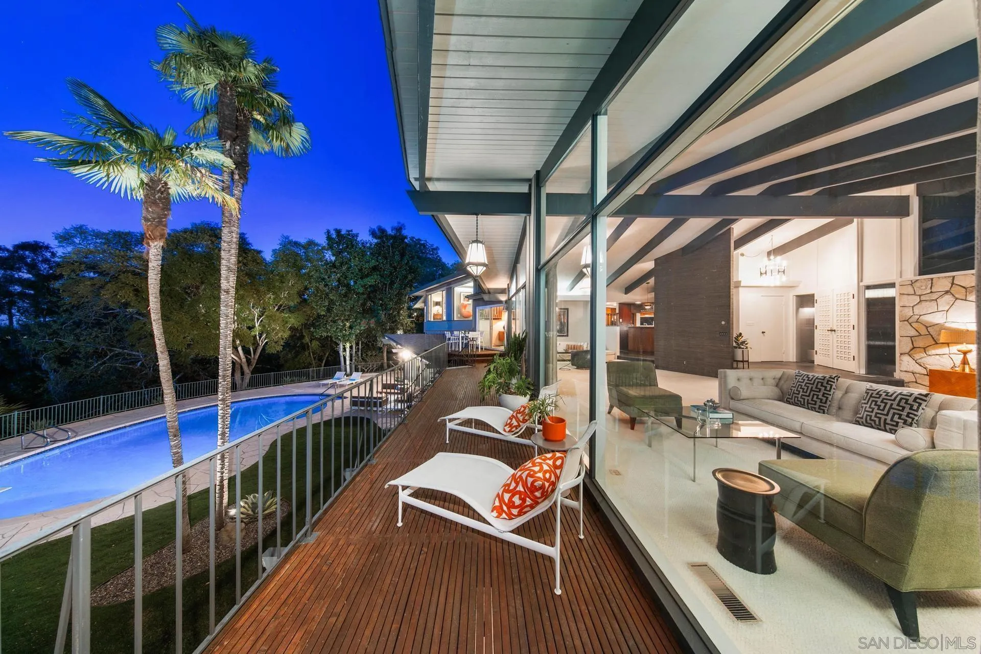 10446 Russell Road La Mesa, CA 91941 - Photo 12 of 75 a view of a balcony with chairs and wooden floor