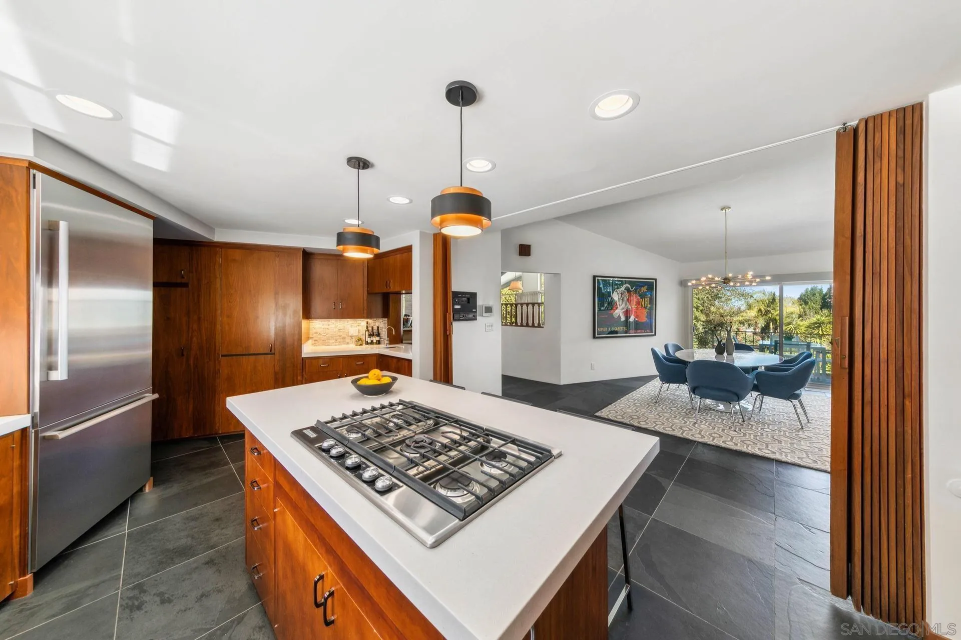 10446 Russell Road La Mesa, CA 91941 - Photo 17 of 75 a kitchen with a stove a refrigerator and a view of living room