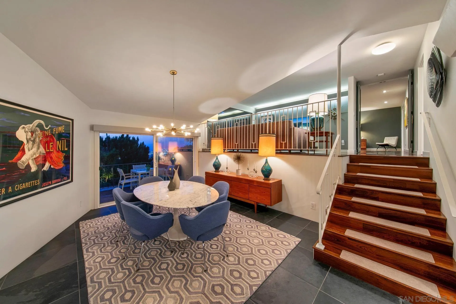 10446 Russell Road La Mesa, CA 91941 - Photo 21 of 75 a living room with furniture a rug and a chandelier