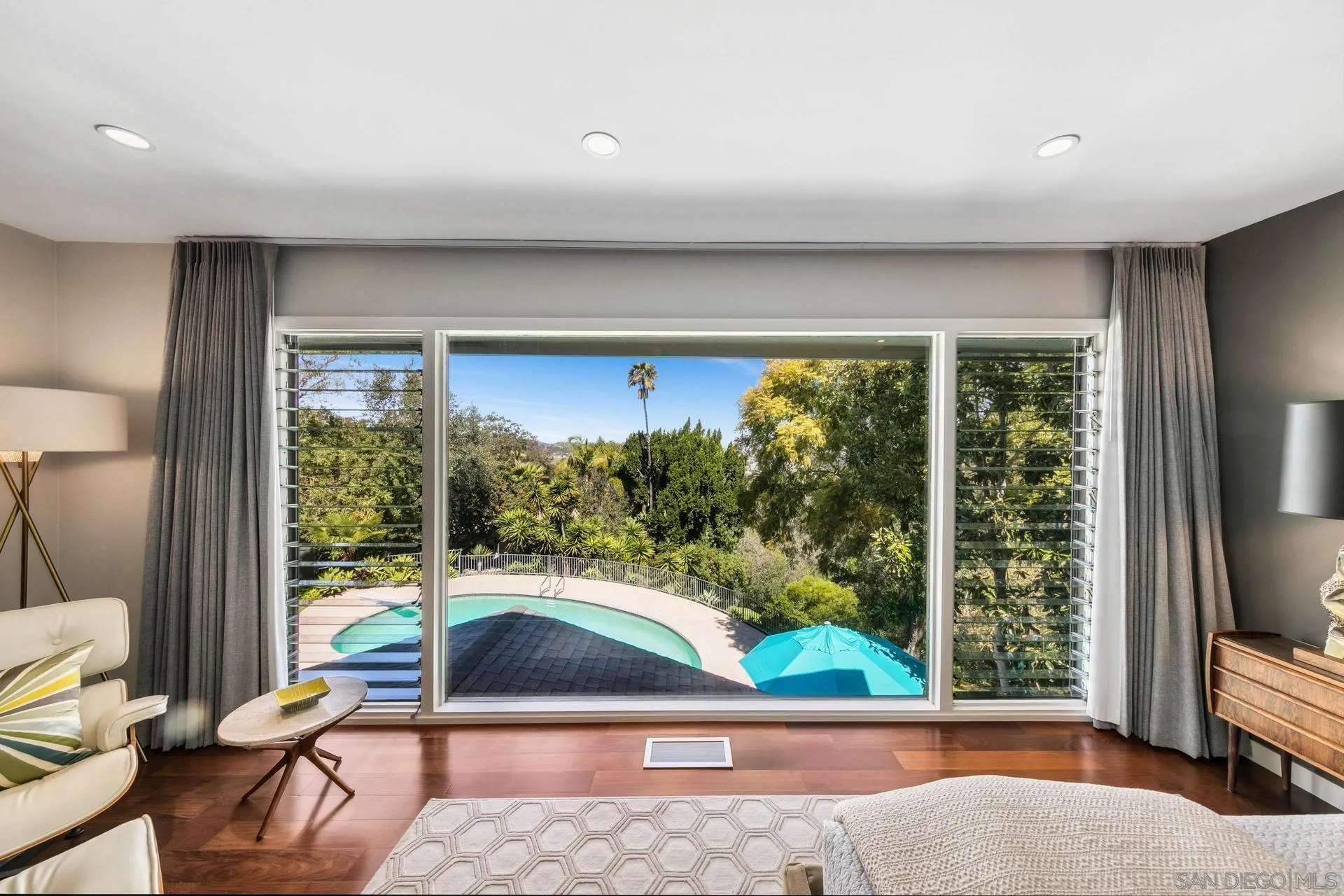 10446 Russell Road La Mesa, CA 91941 - Photo 28 of 75 a living room with large window and floor to ceiling window
