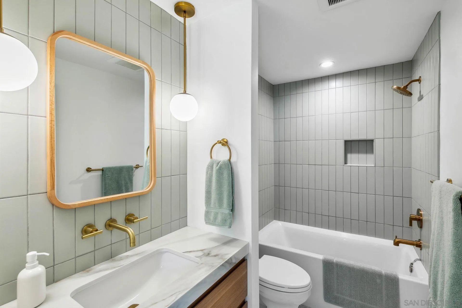 10446 Russell Road La Mesa, CA 91941 - Photo 39 of 75 a bathroom with a sink a toilet and shower