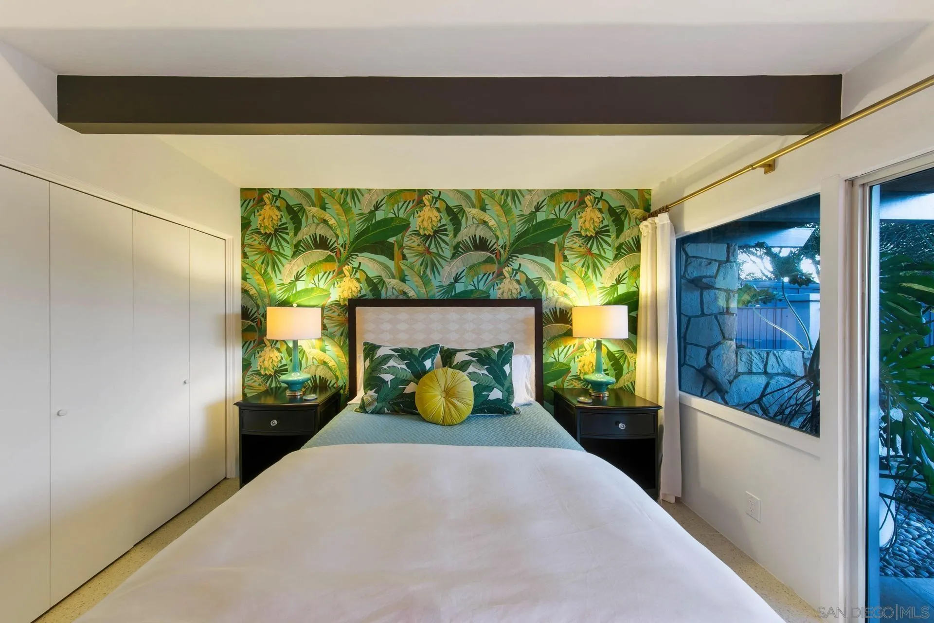 10446 Russell Road La Mesa, CA 91941 - Photo 44 of 75 a bedroom with a bed and large window