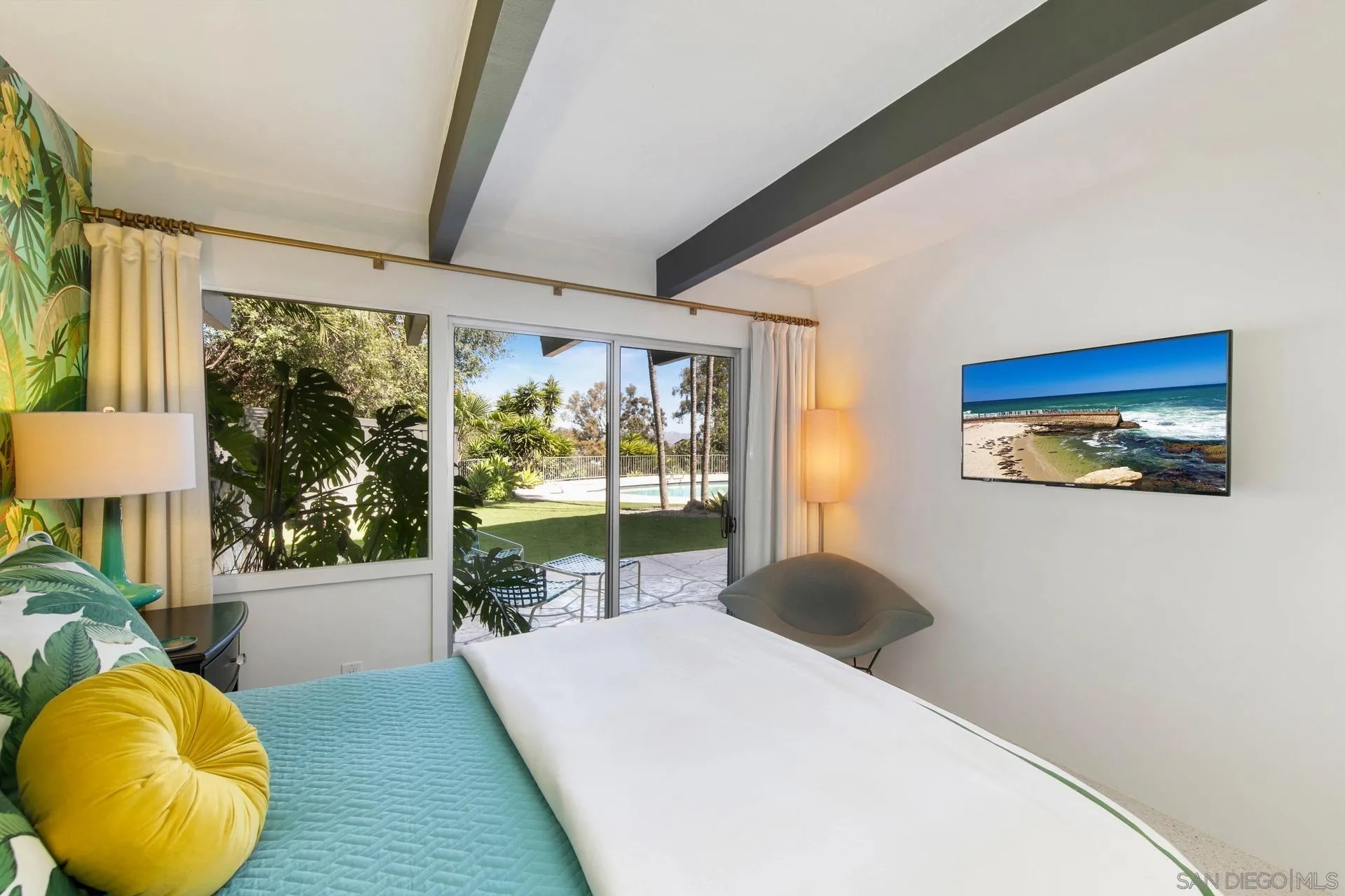 10446 Russell Road La Mesa, CA 91941 - Photo 45 of 75 a bedroom with a large bed and a large window