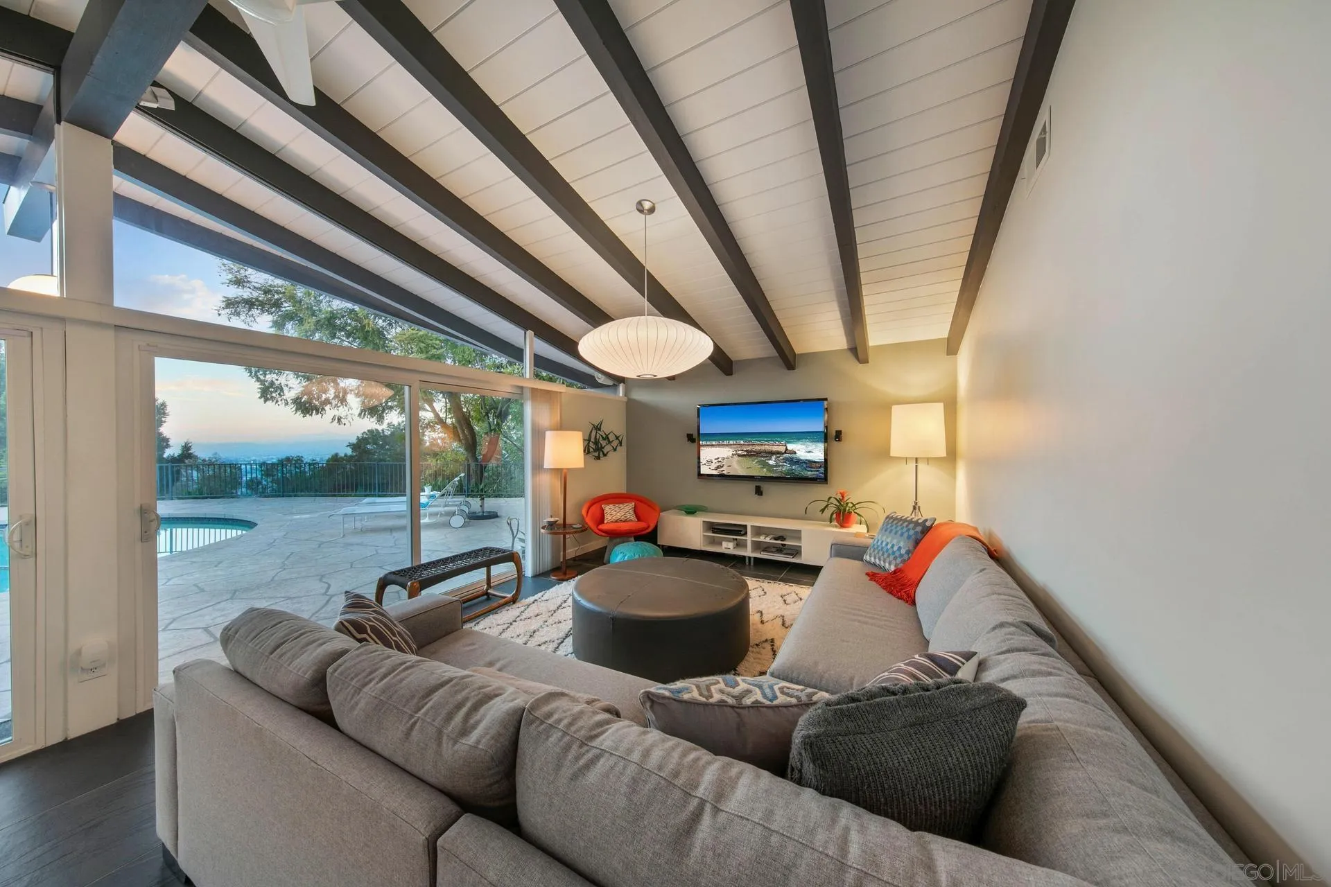 10446 Russell Road La Mesa, CA 91941 - Photo 46 of 75 a living room with furniture a couch and a large window
