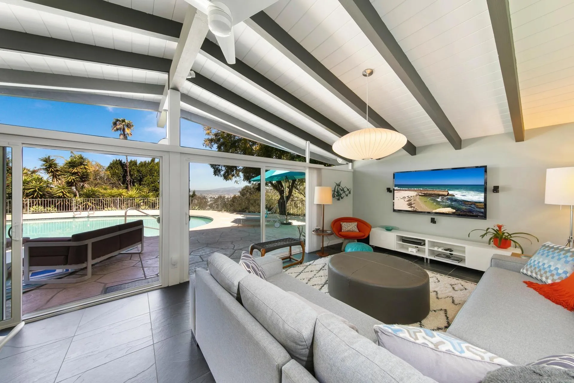 10446 Russell Road La Mesa, CA 91941 - Photo 47 of 75 a living room with furniture and a flat screen tv