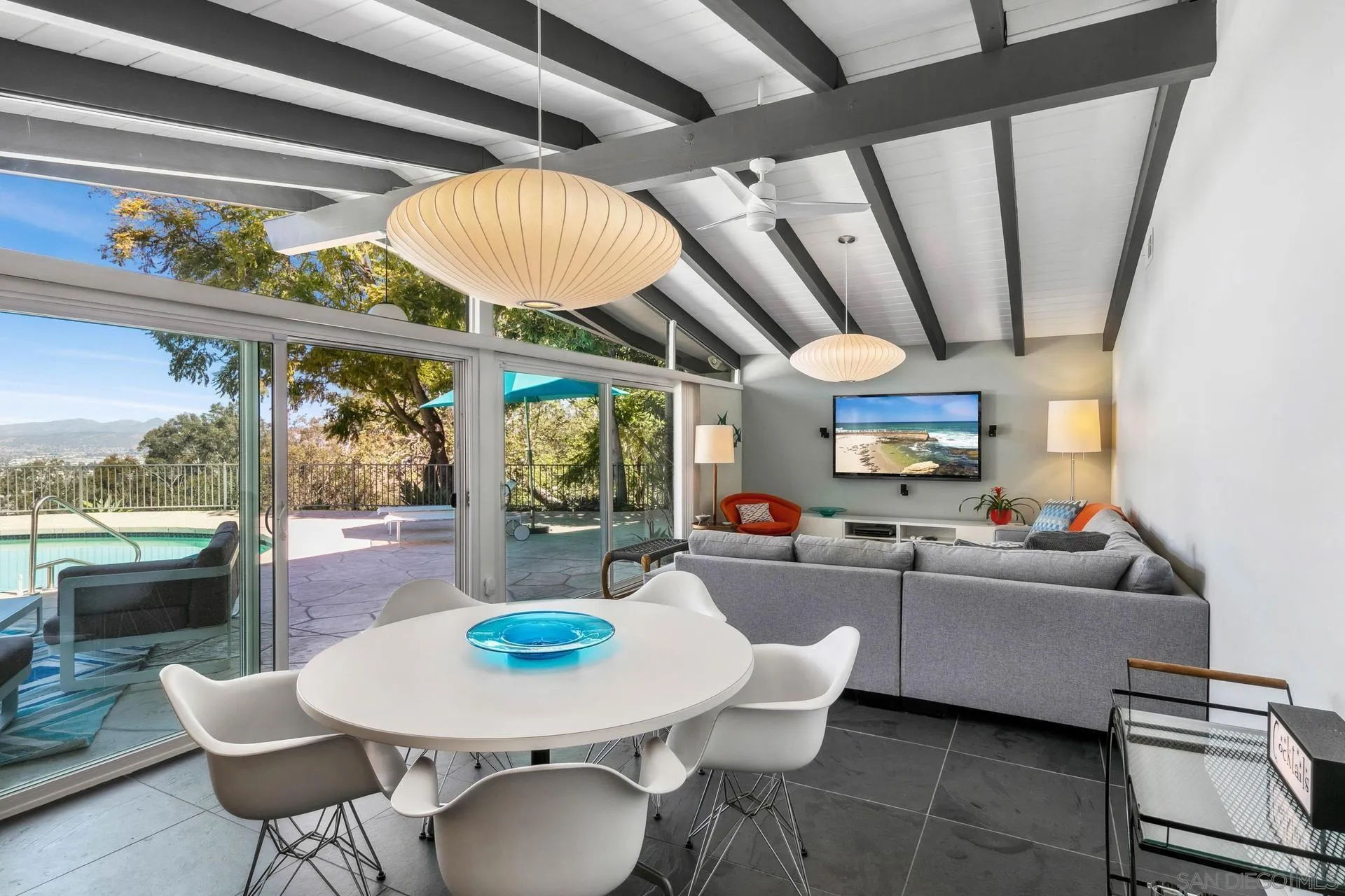 10446 Russell Road La Mesa, CA 91941 - Photo 48 of 75 a living room with furniture a fireplace and a large window