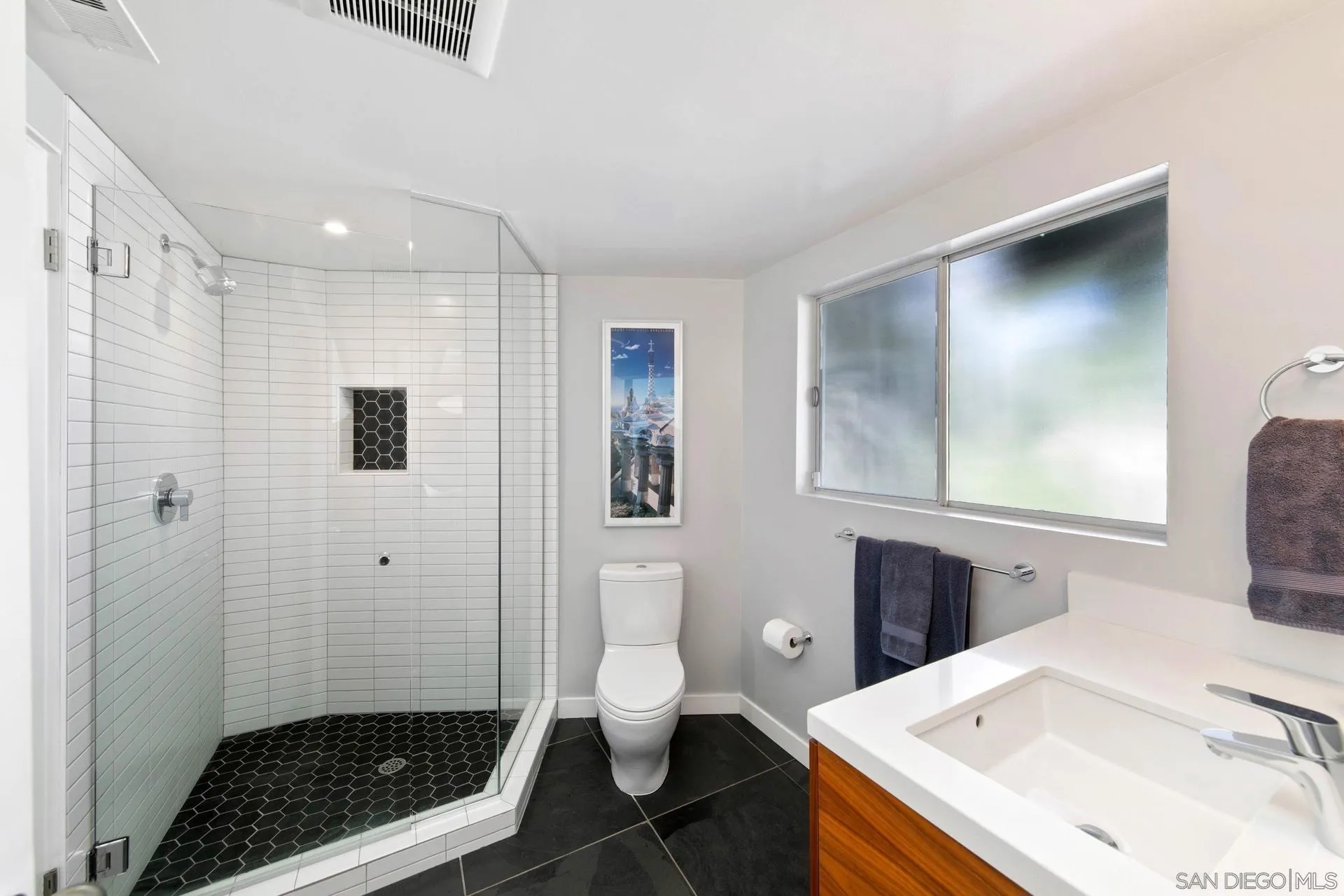 10446 Russell Road La Mesa, CA 91941 - Photo 53 of 75 a bathroom with a sink toilet and shower