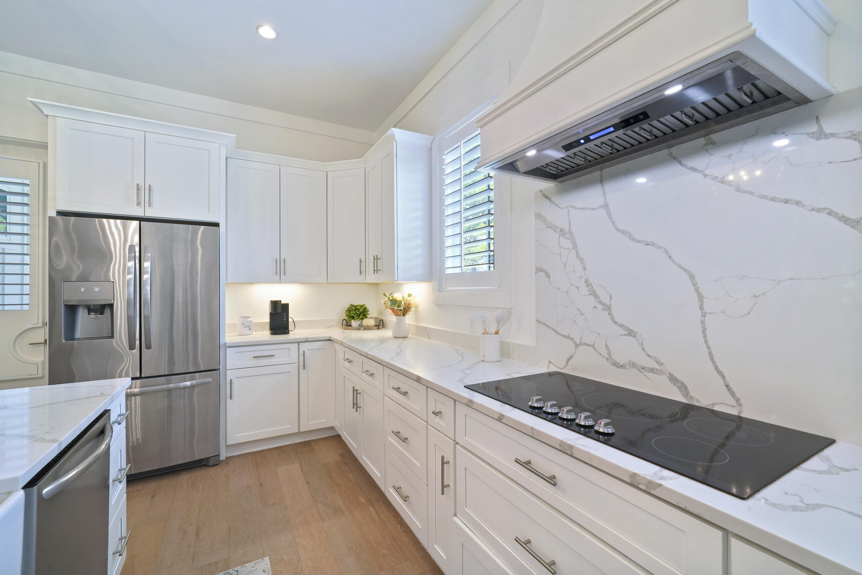76 Tanglewood Drive Santa Rosa Beach, FL 32459 - Photo 22 of 94 a kitchen with white cabinets and appliances