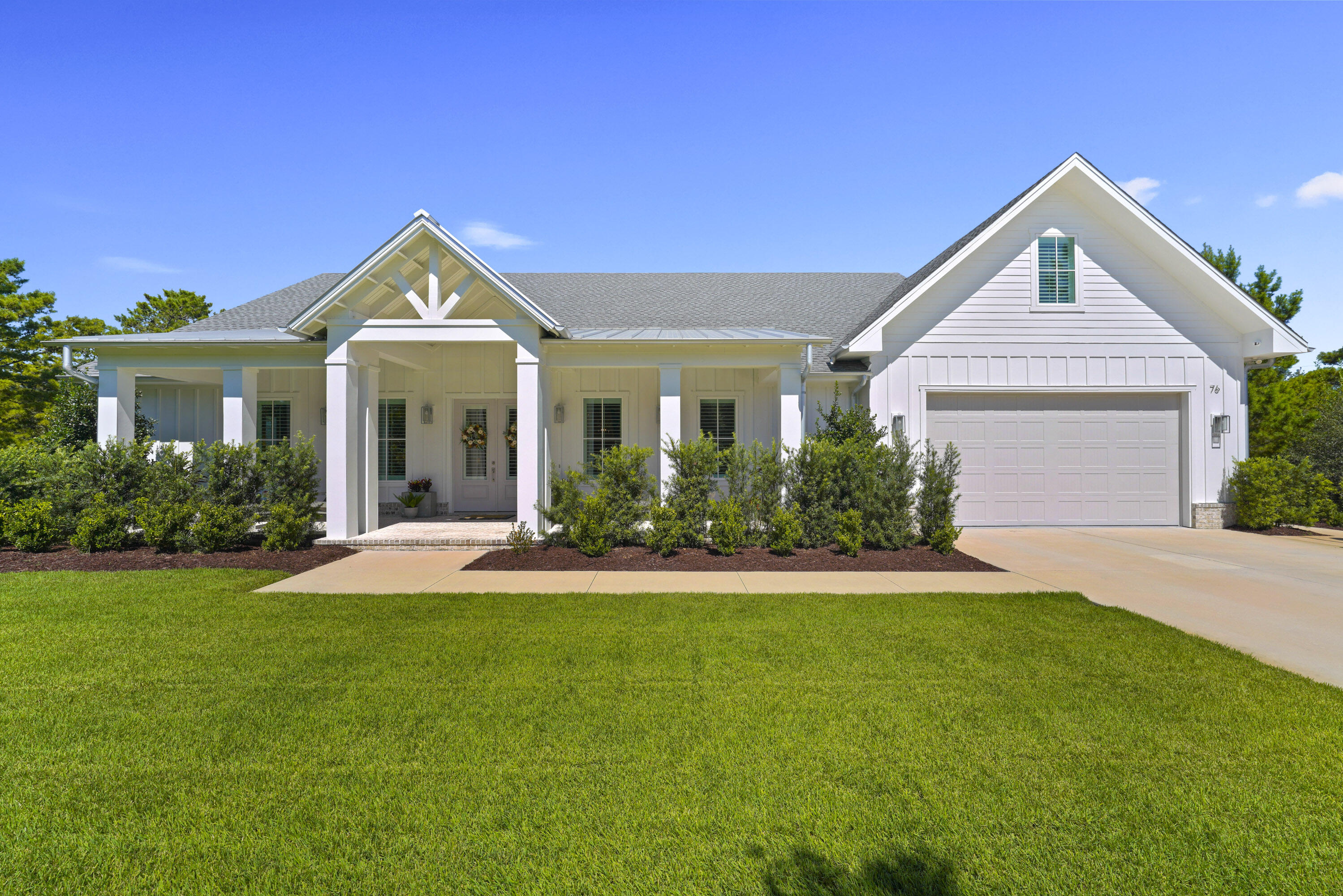 76 Tanglewood Drive Santa Rosa Beach, FL 32459 - Photo 3 of 94 a front view of a house with a yard and garage