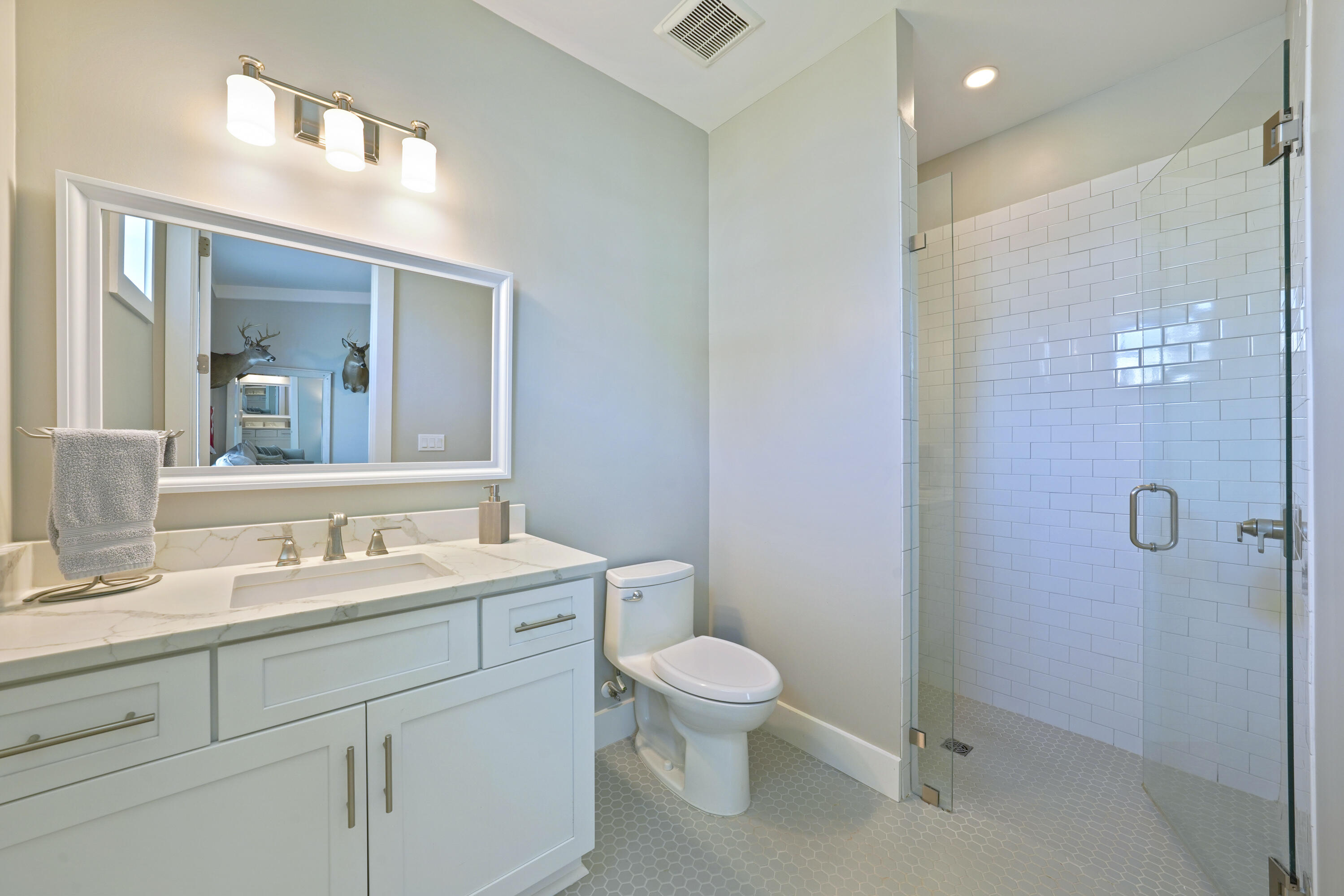 76 Tanglewood Drive Santa Rosa Beach, FL 32459 - Photo 48 of 94 a bathroom with a toilet sink and mirror