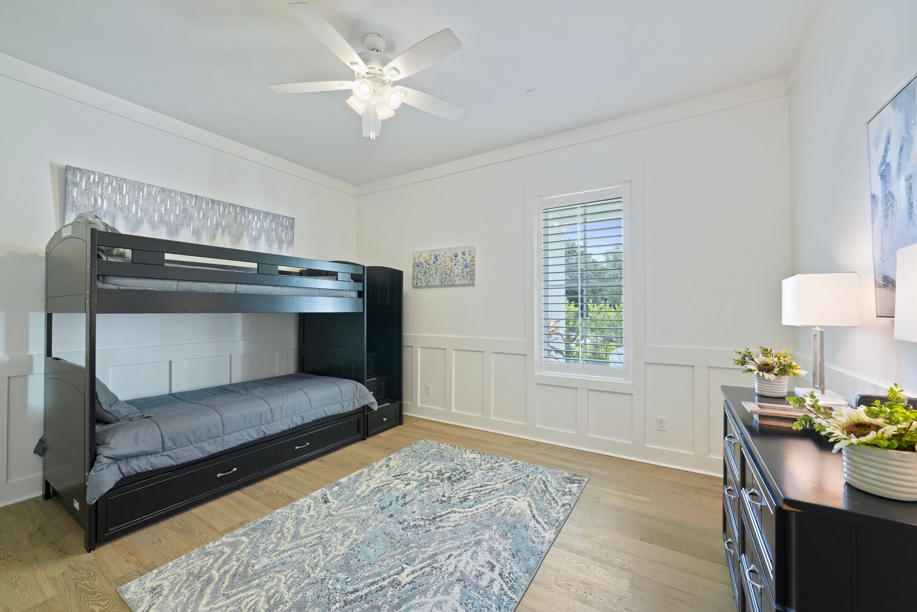 76 Tanglewood Drive Santa Rosa Beach, FL 32459 - Photo 50 of 94 a bedroom with a bed and a chandelier