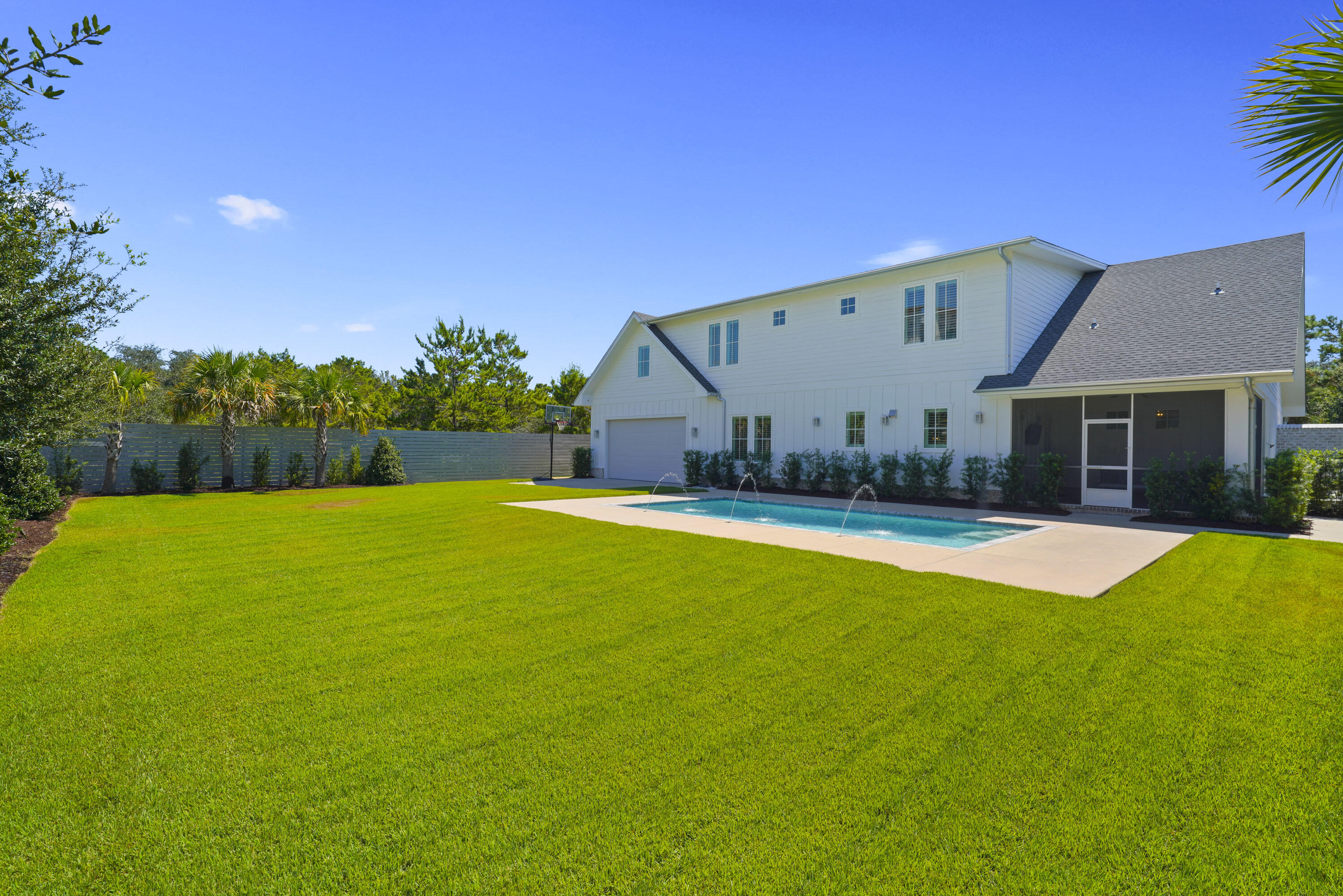 76 Tanglewood Drive Santa Rosa Beach, FL 32459 - Photo 73 of 94 a view of a house with swimming pool and a yard