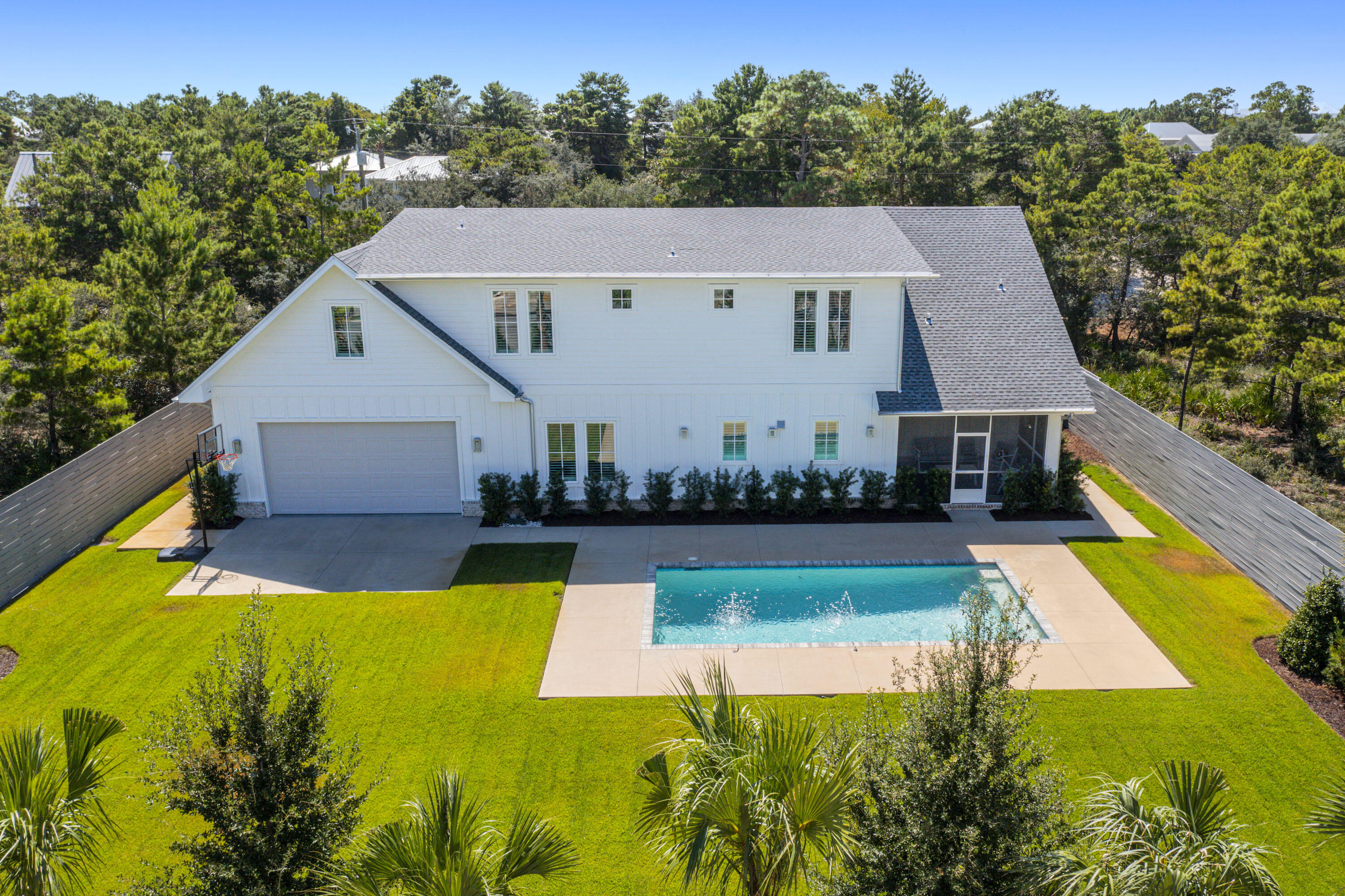 76 Tanglewood Drive Santa Rosa Beach, FL 32459 - Photo 83 of 94 an aerial view of a house with swimming pool and a yard