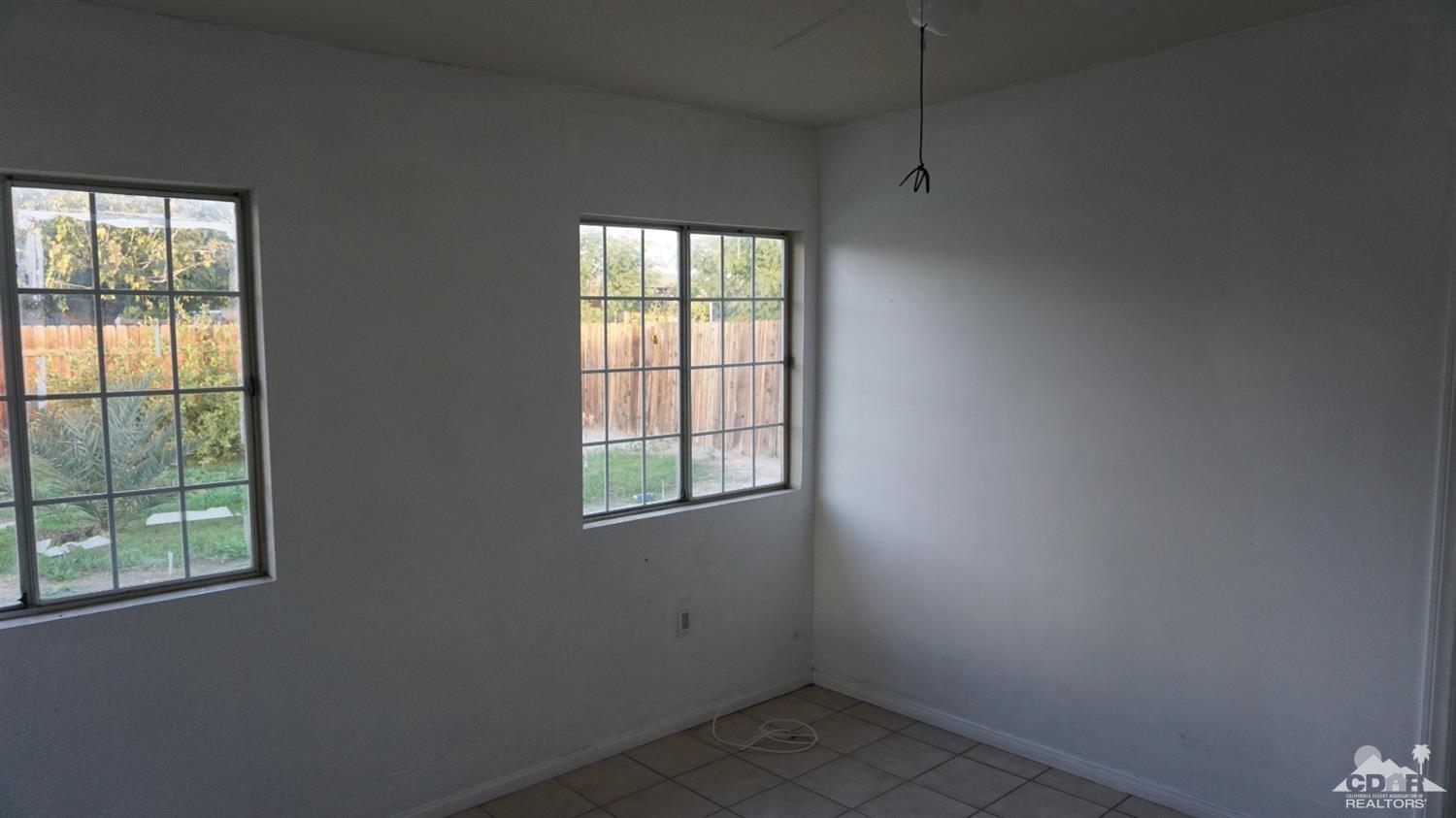 82342 Adobe Road Indio, CA 92201 - Photo 22 of 26 an empty room with a window
