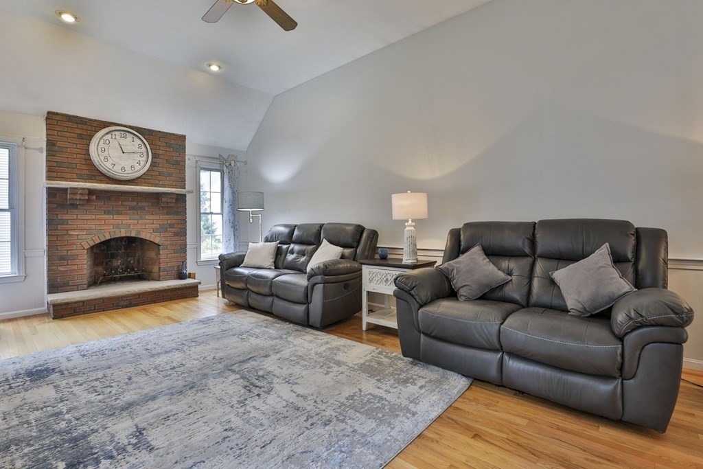 5 Hancock Road Windham, NH 03087 - Photo 12 of 41 a living room with furniture and a fireplace